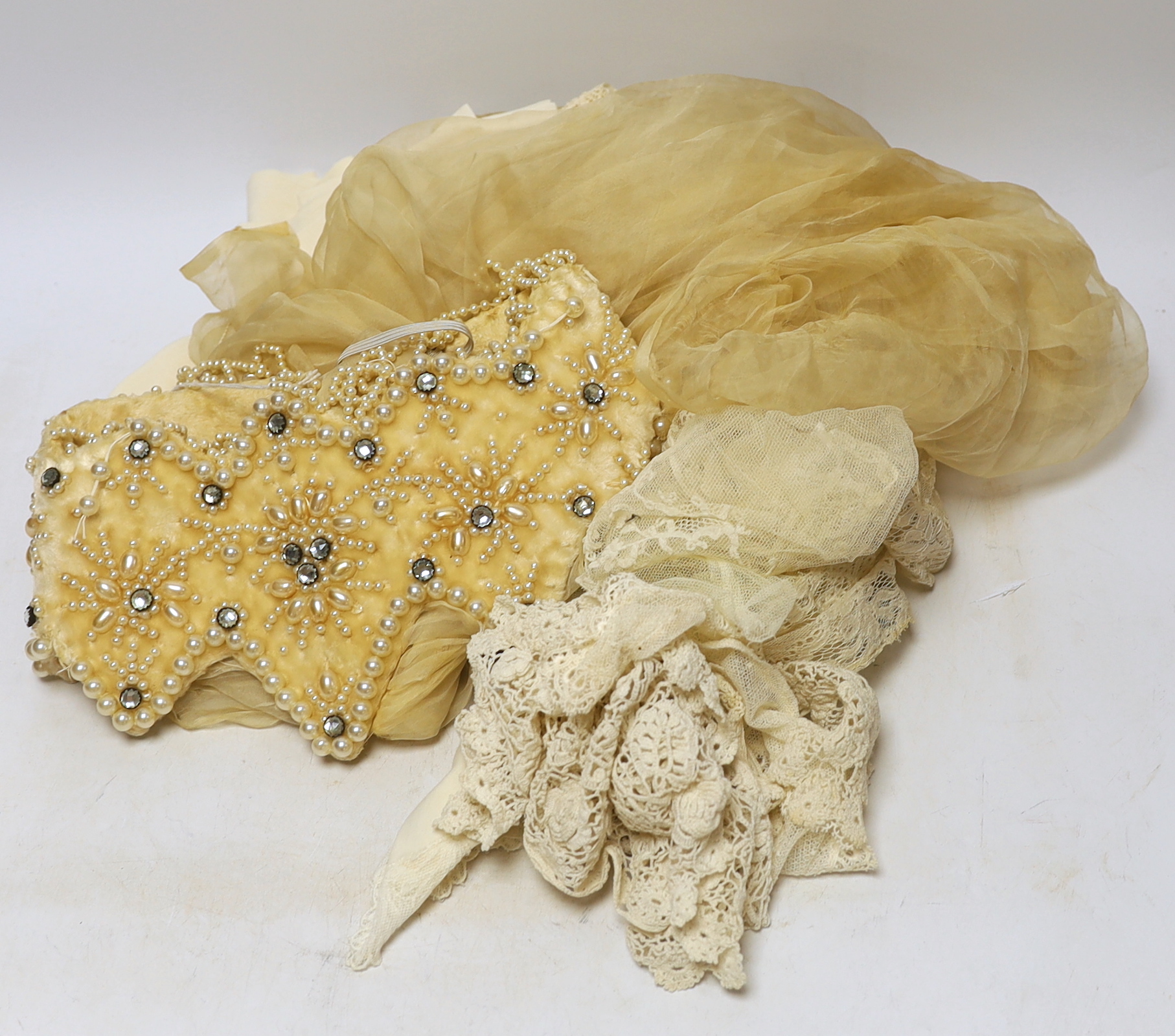 An Edwardian fine machine lace stole and various handmade and machine lace collars and trimmings, with a wedding veil from 1920's and pearl and diamonté head-dress